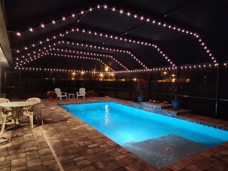 Pool enclosure with permanent LED lighting