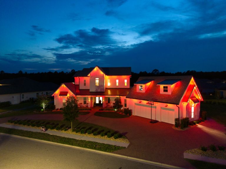 Home with fall-colored permanent lighting